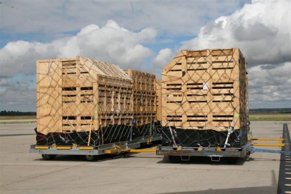 Livestock crates ready for loading at an airport
